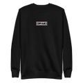 Black crewneck sweatshirt with the embroidered Red Label ELITE® icon on the chest
