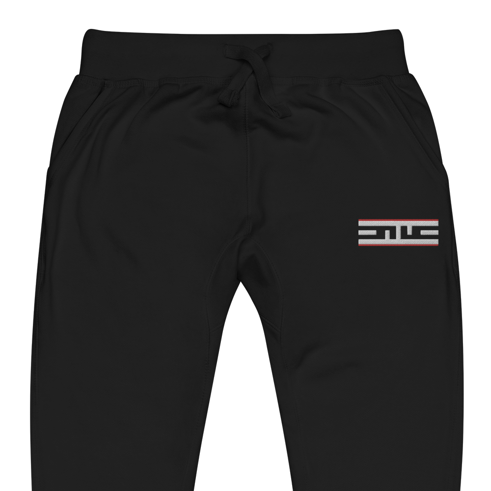 Close-up of the Red Label ELITE® icon on the black sweatpants