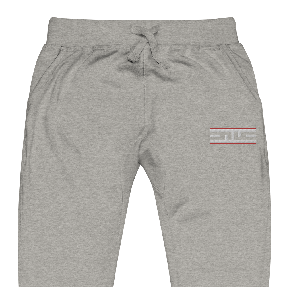 Close-up of the Red Label ELITE® icon on the carbon grey sweatpants