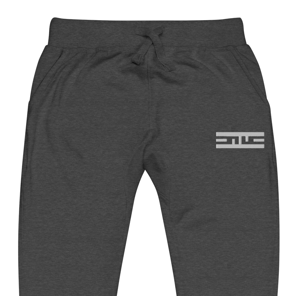 Close-up of the white ELITE® icon on the charcoal heather ELITE® Icon Sweatpants