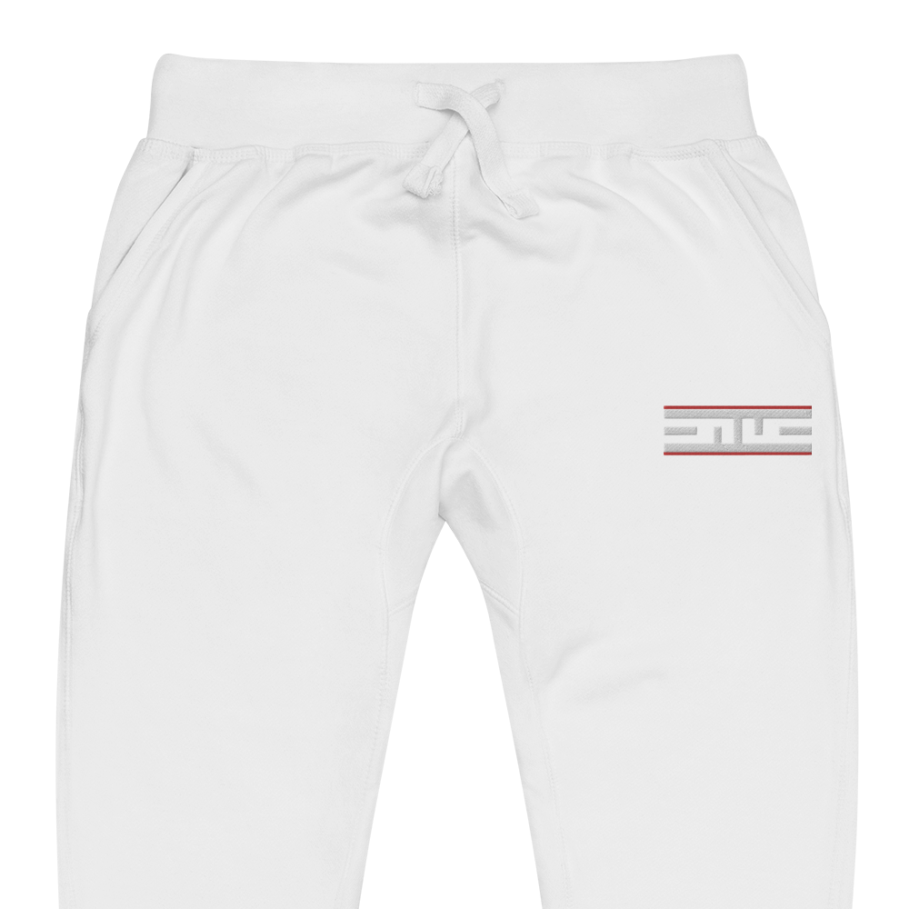 Close-up of the Red Label ELITE® icon on the white sweatpants